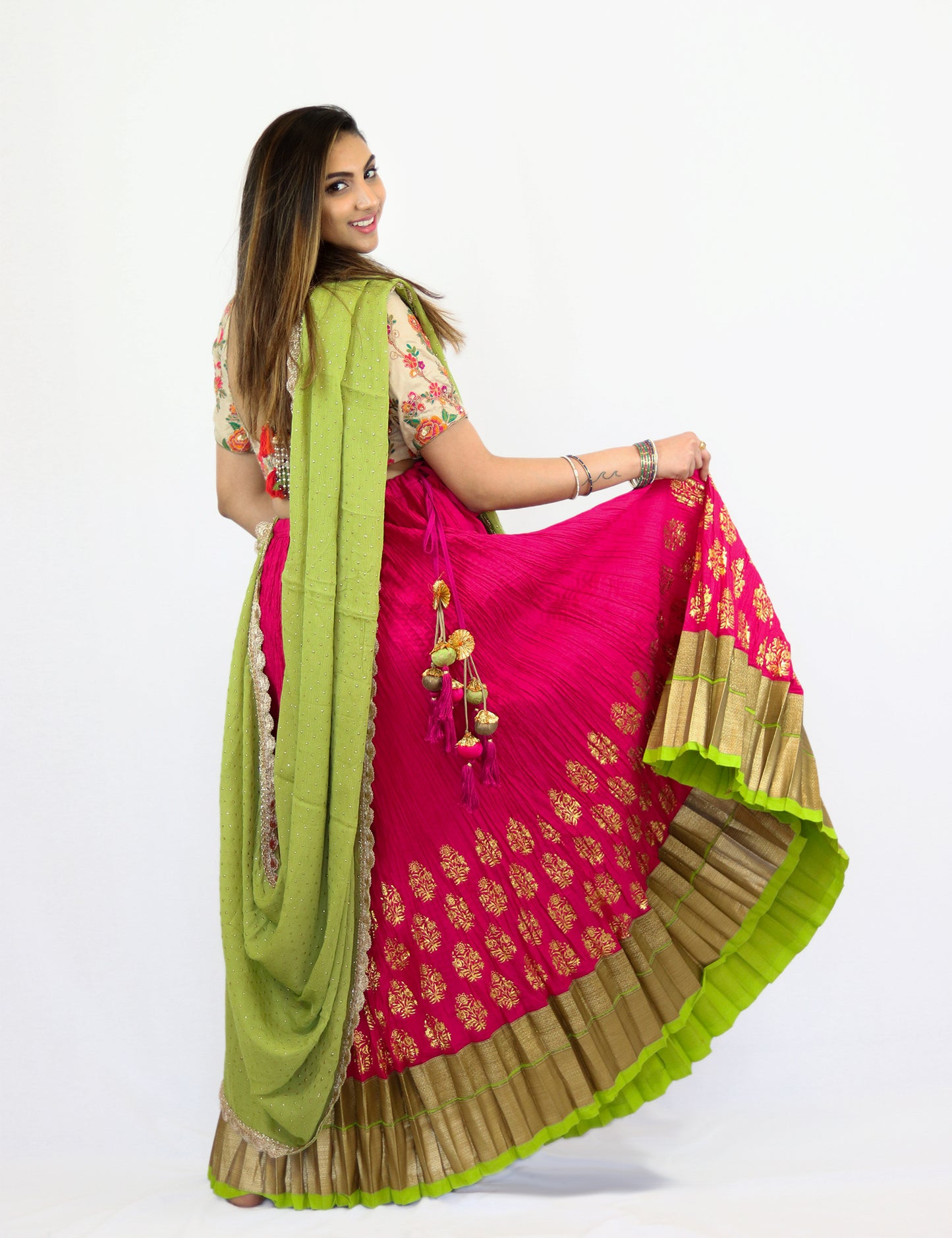 Rent Pink Pleated Lehenga with Embroidered blouse and Lime Green Dupatta